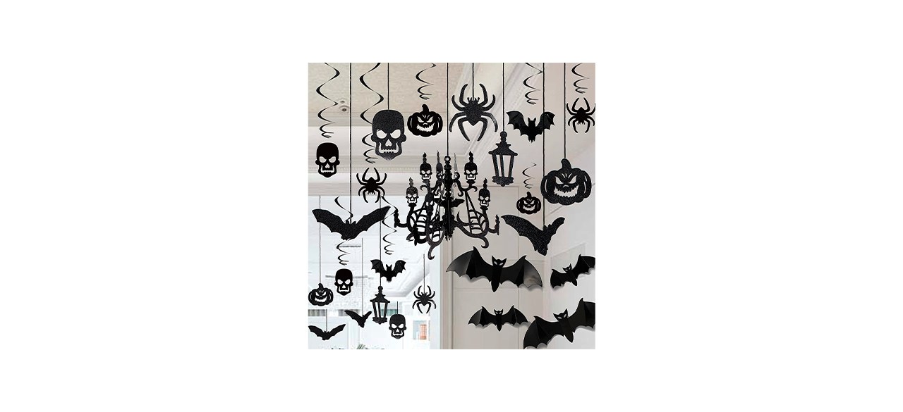 hanging black paper decorations in the shape of skulls, bats, pumpkins, spiders and more