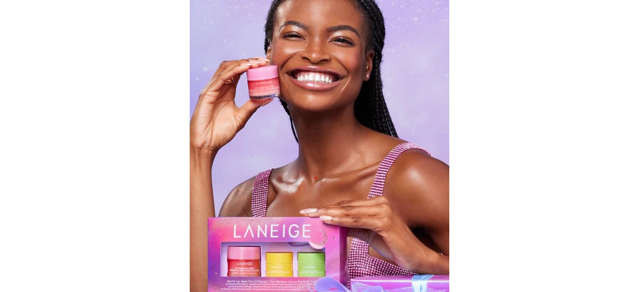 Woman with LANEIGE Starlit Mask Trio on purple background