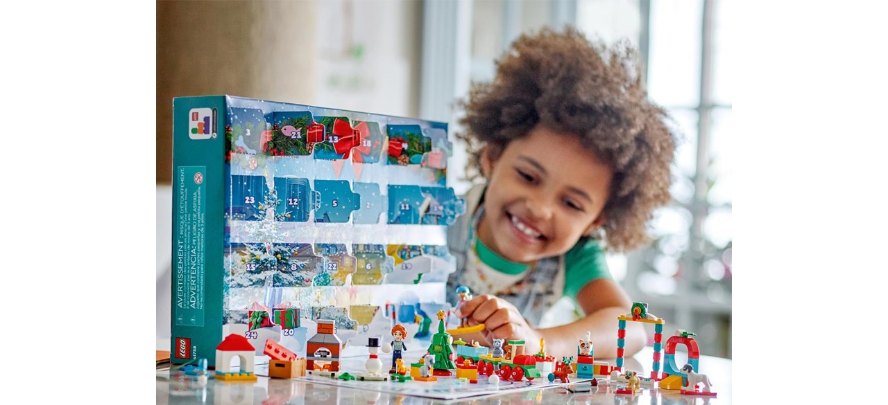 Child playing with LEGO Friends 2023 Advent Calendar