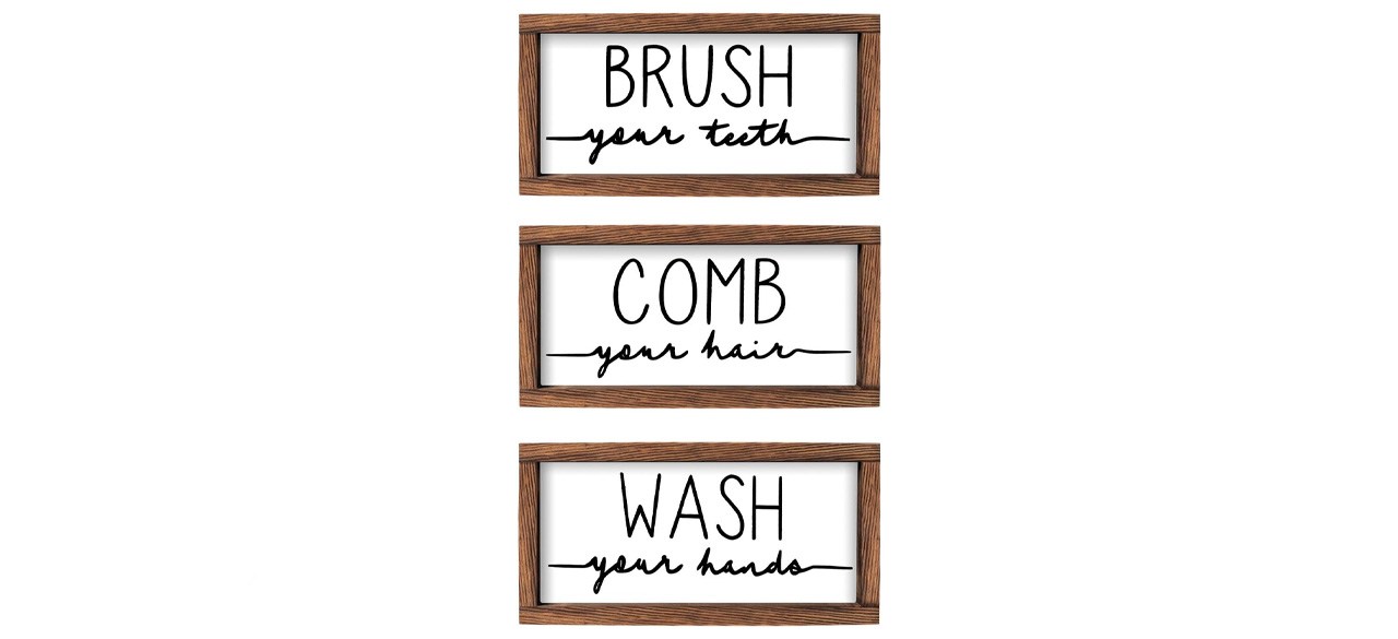 three framed plaques that read (respectively): brush your teeth, comb your hair, wash your hands
