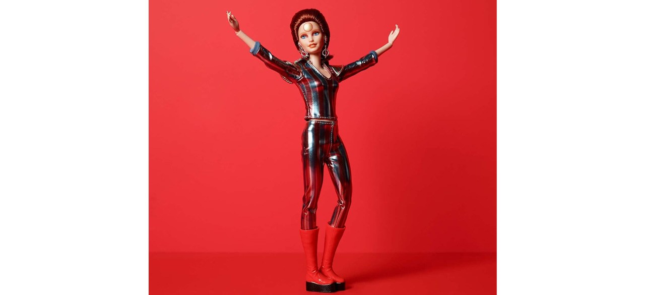 Barbie David Bowie Doll with arms raised on red background