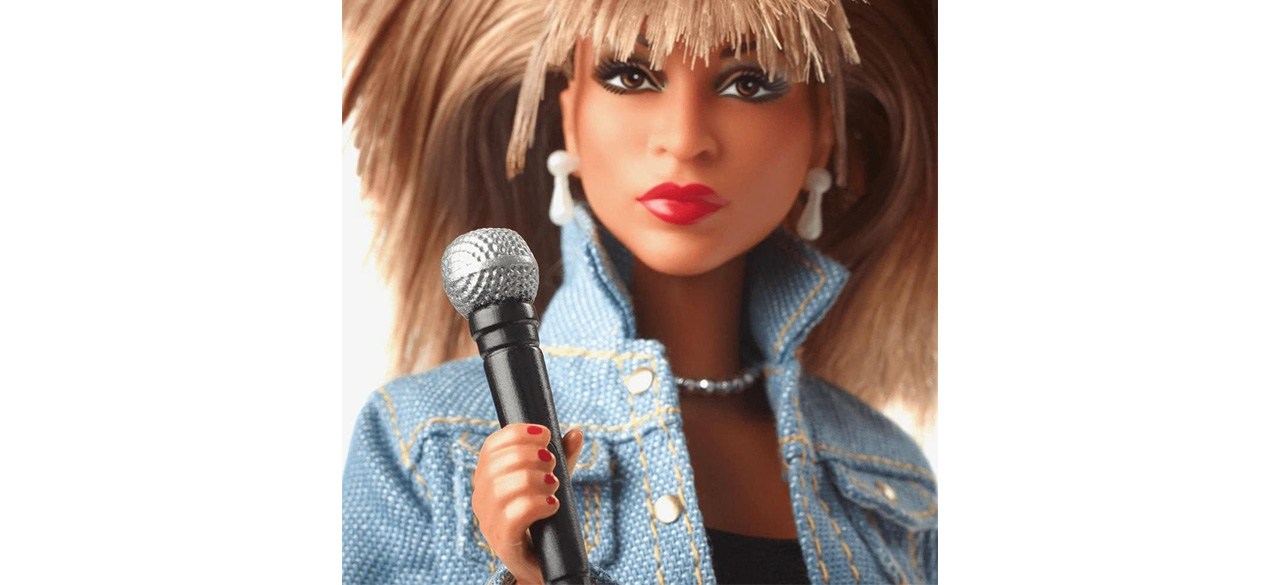 Barbie Signature Tina Turner Barbie Doll holding microphone wearing denim jacket