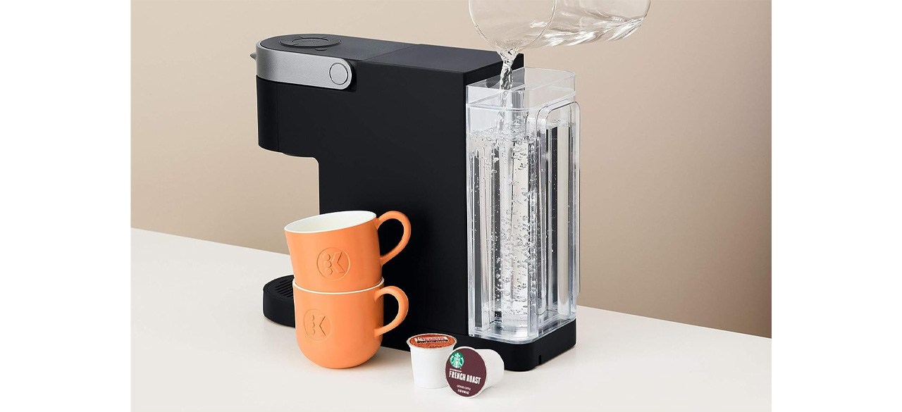 Black Keurig K- Slim Single Serve K-Cup Pod Coffee Maker with orange cups