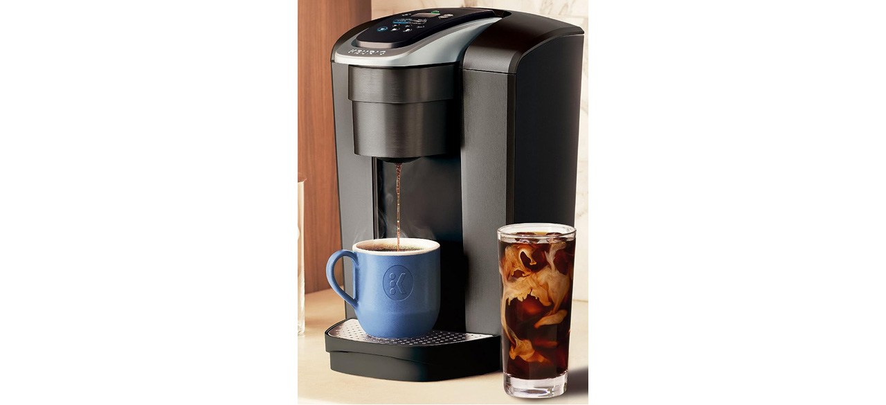Black Keurig K-Elite Single-Serve K-Cup Pod Coffee Maker with blue cup on countertop