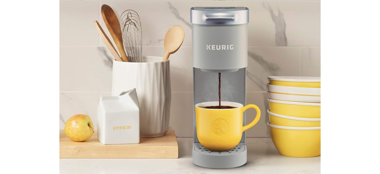 Gray Keurig K-Mini Single Serve Coffee Maker with yellow cup on countertop