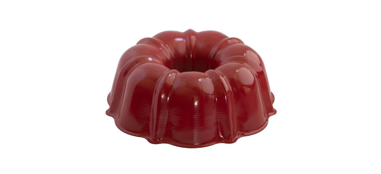 aluminum red bundt pan on white background