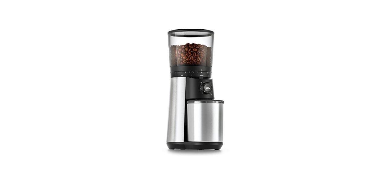 A coffee grinder with coffee beans in it