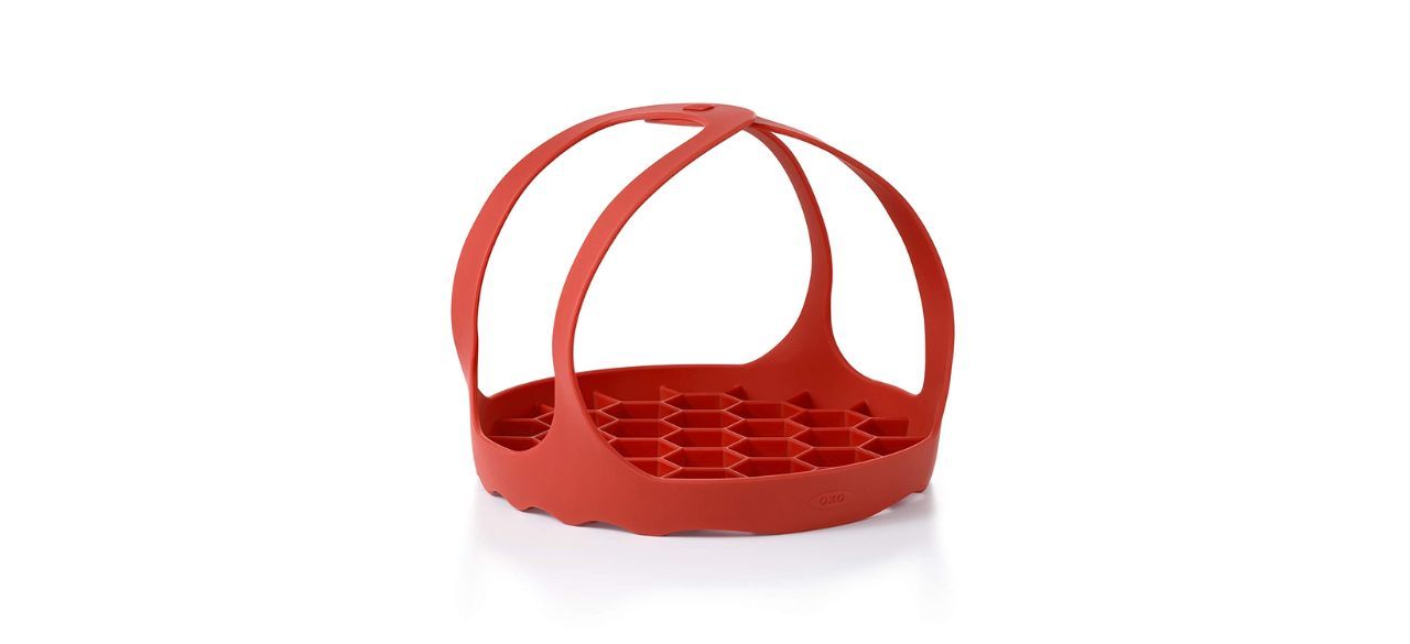 red silicone OXO Good Grips Pressure Cooker Bakeware Sling on white background