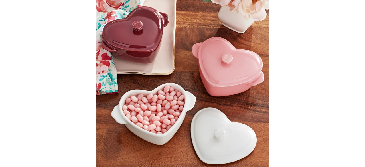 The Pioneer Woman 3-Piece Mini Hearts Ceramic Baking Dish with candy on tabletop