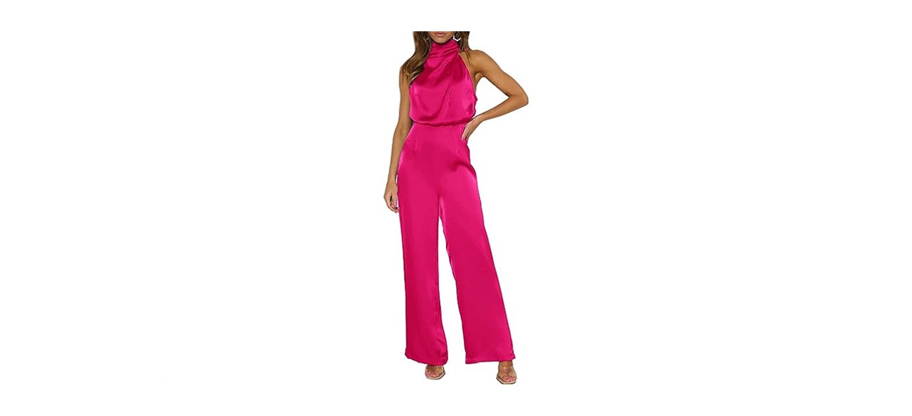 a woman wearing a sleeveless red satin jumpsuit