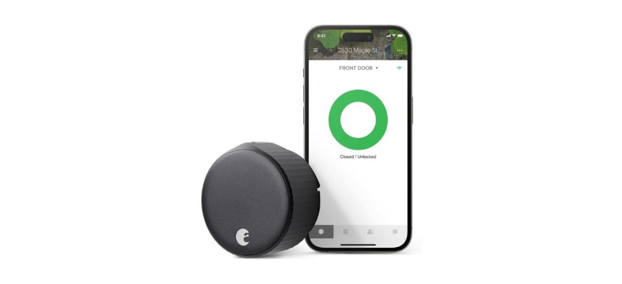 August Home Smart Lock next to a smartphone showing the accompanying app August Home Smart Lock next to a smartphone showing the accompanying app