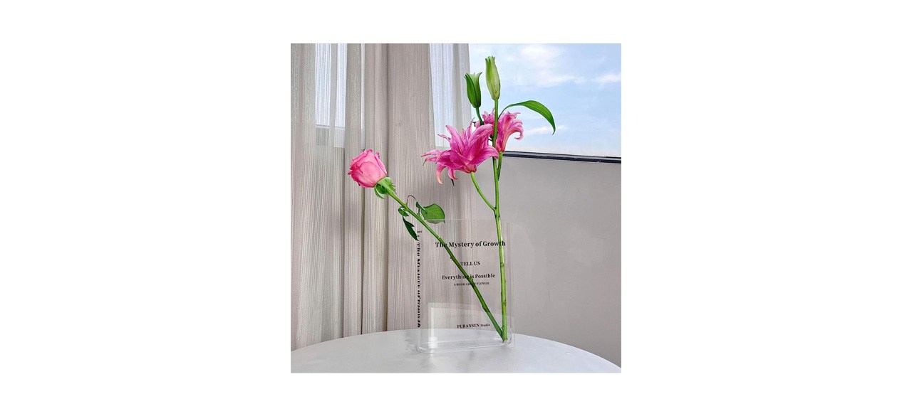 Puransen Book Vase with pink flowers on table