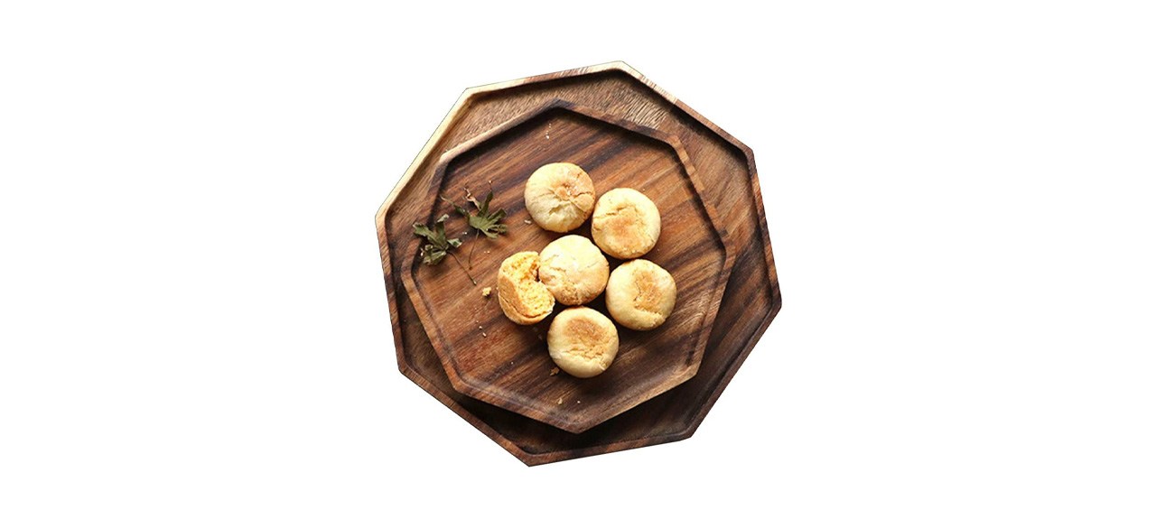 2 wooden, 8-sided serving platters with bread on them