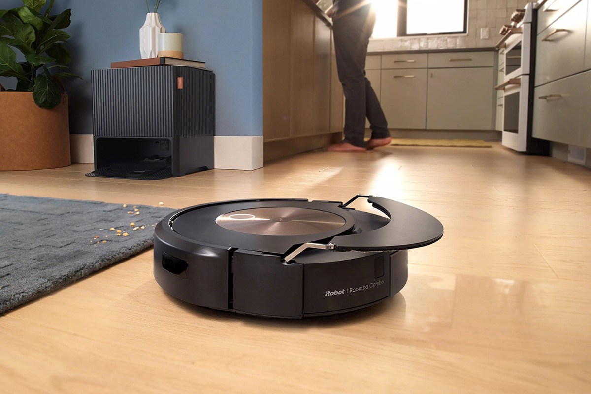 Roomba Combo j9+ on hard flooring next to carpeted area