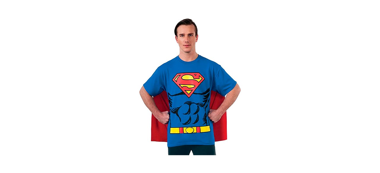 Man wearing Superman shirt with attached red cape