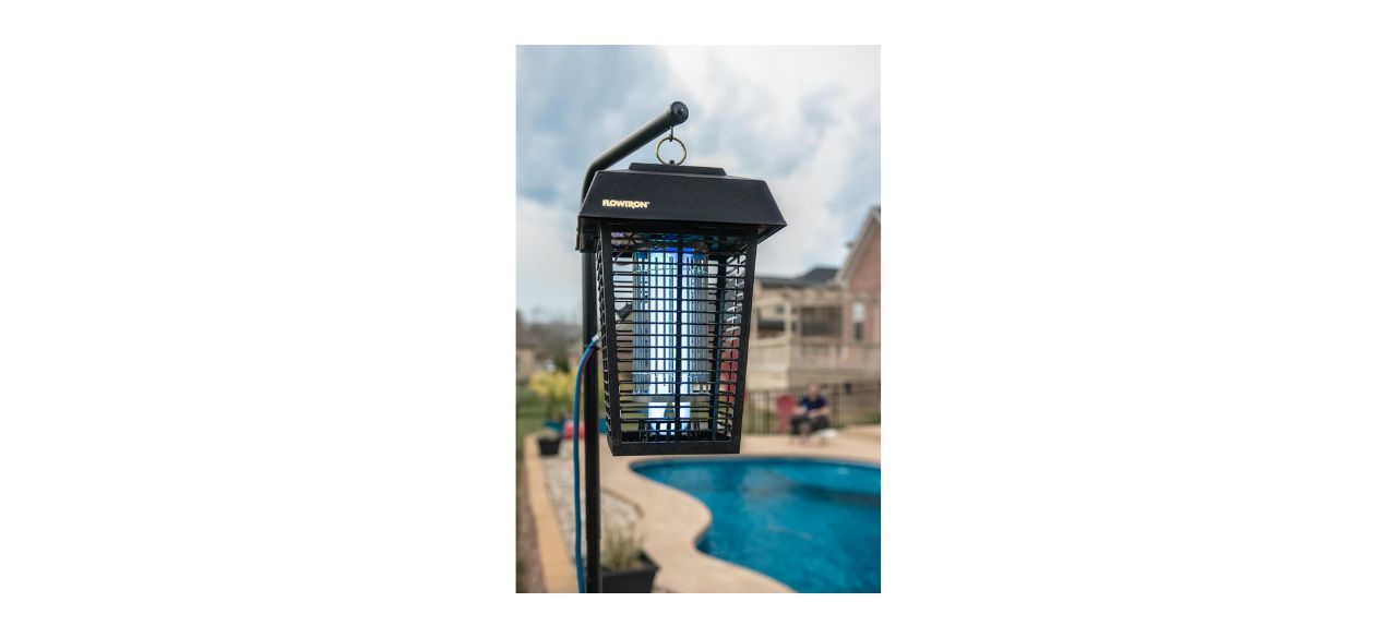 Flowtron Bug Zapper hanging outside by a pool