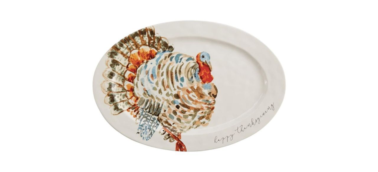 an oblong white platter with an image of a Turkey on it. Text reads, 