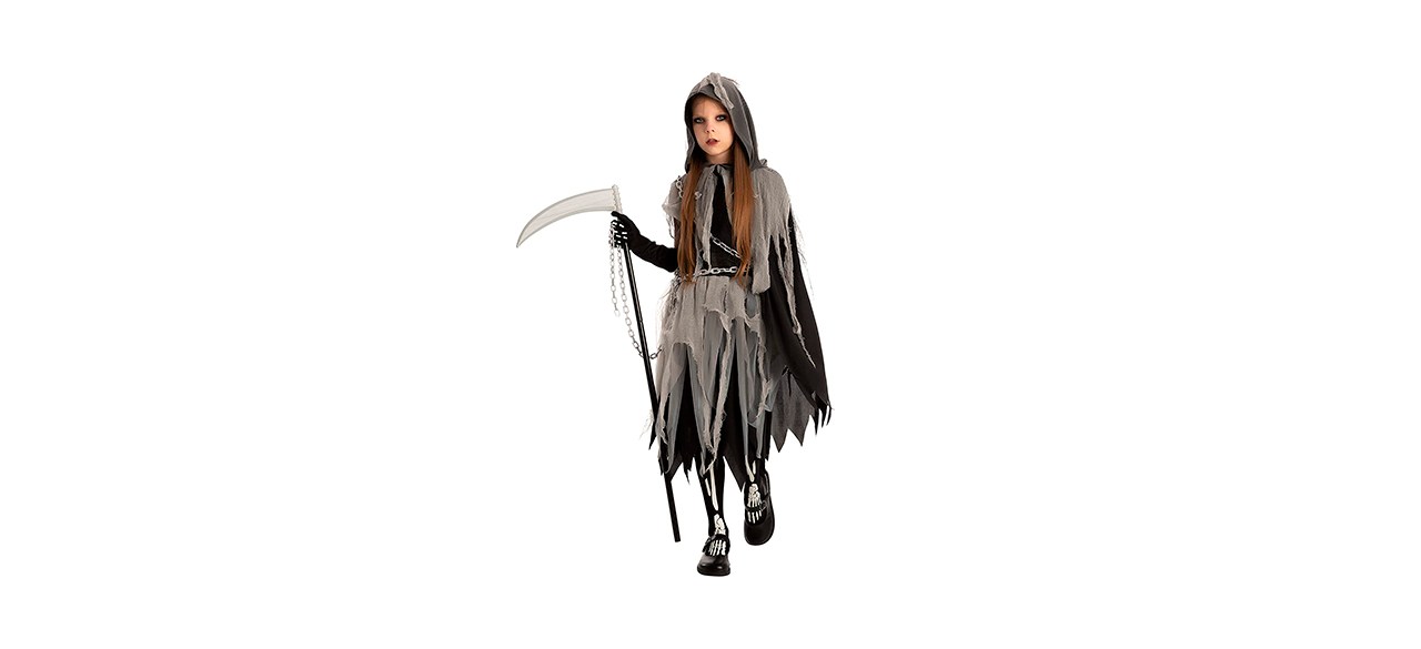 young girl in a grim reaper costume