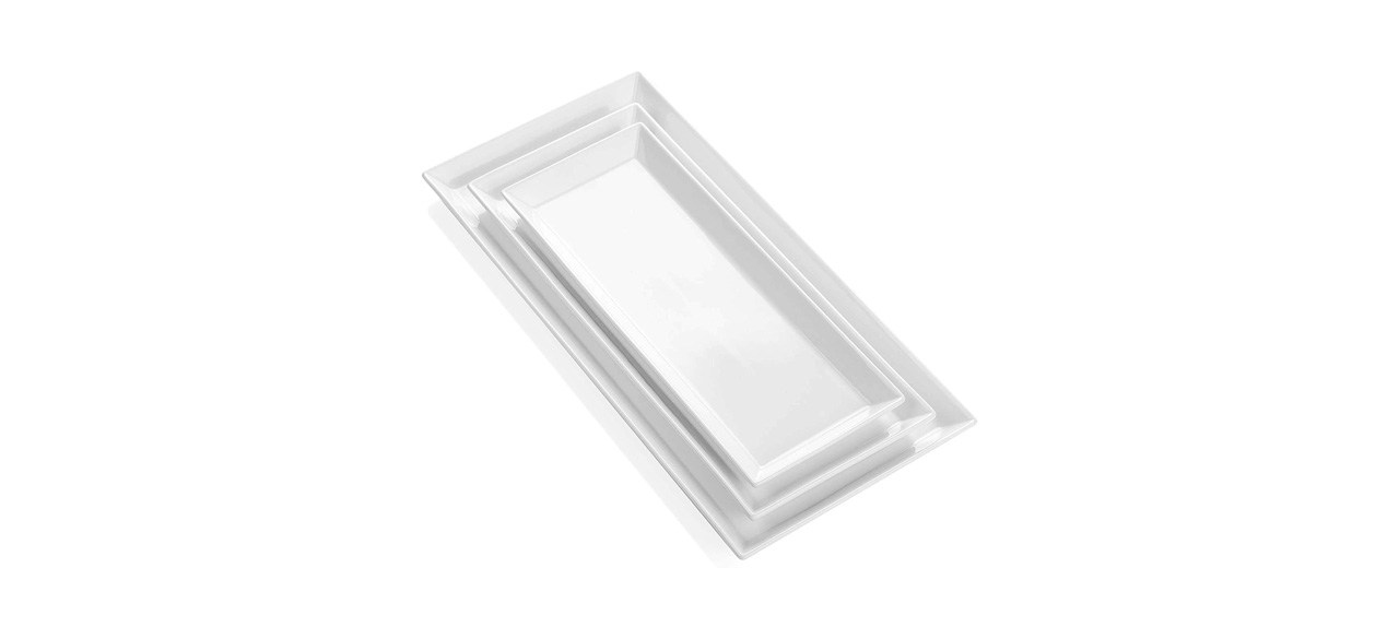 3 stacked white porcelain rectangular serving platters of increasing size