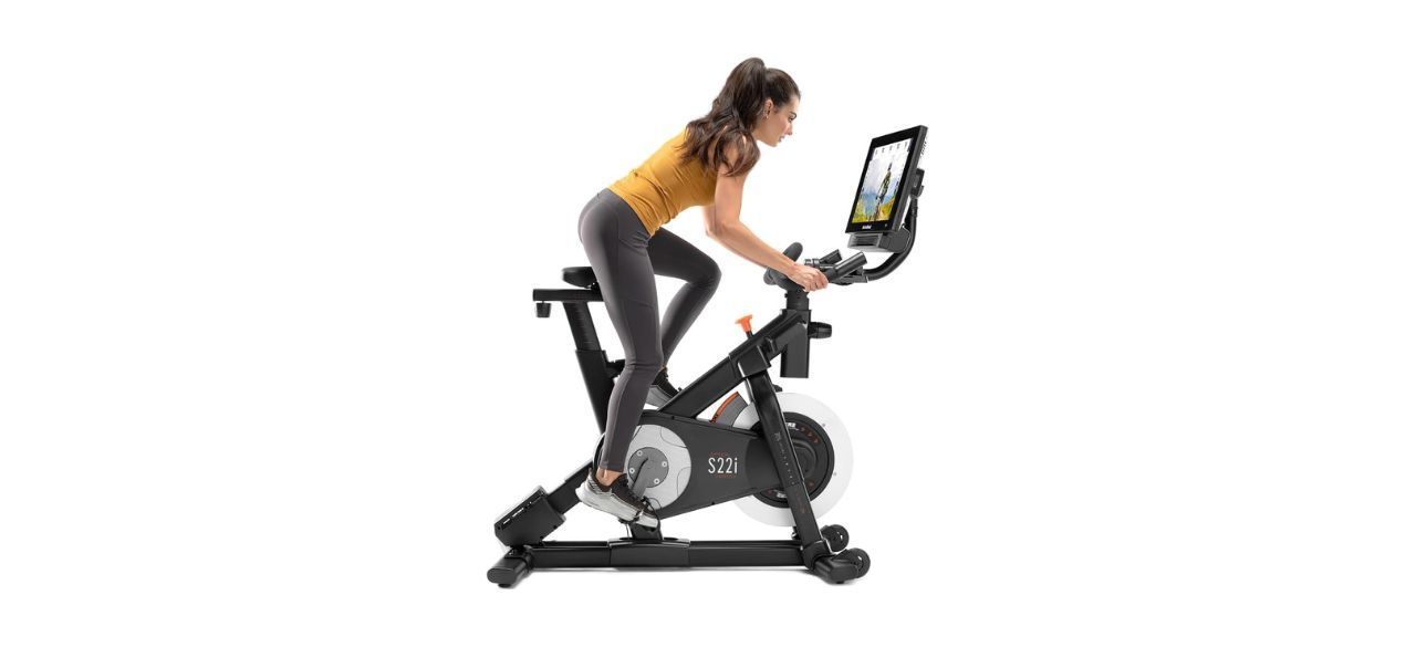 woman riding NordicTrack Commercial Studio Cycle