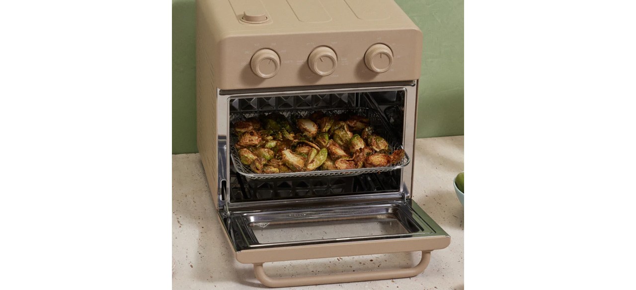 Our Place Wonder Oven with door open and potatoes on cooking tray