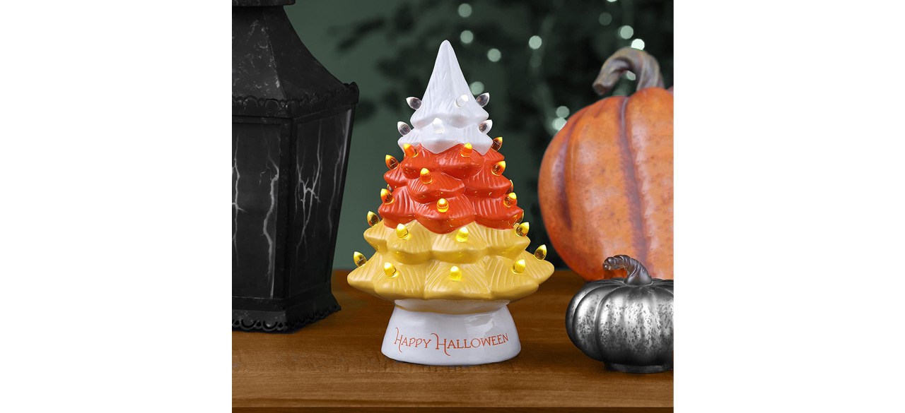 White, orange and yellow Halloween nostalgic ceramic tree on table