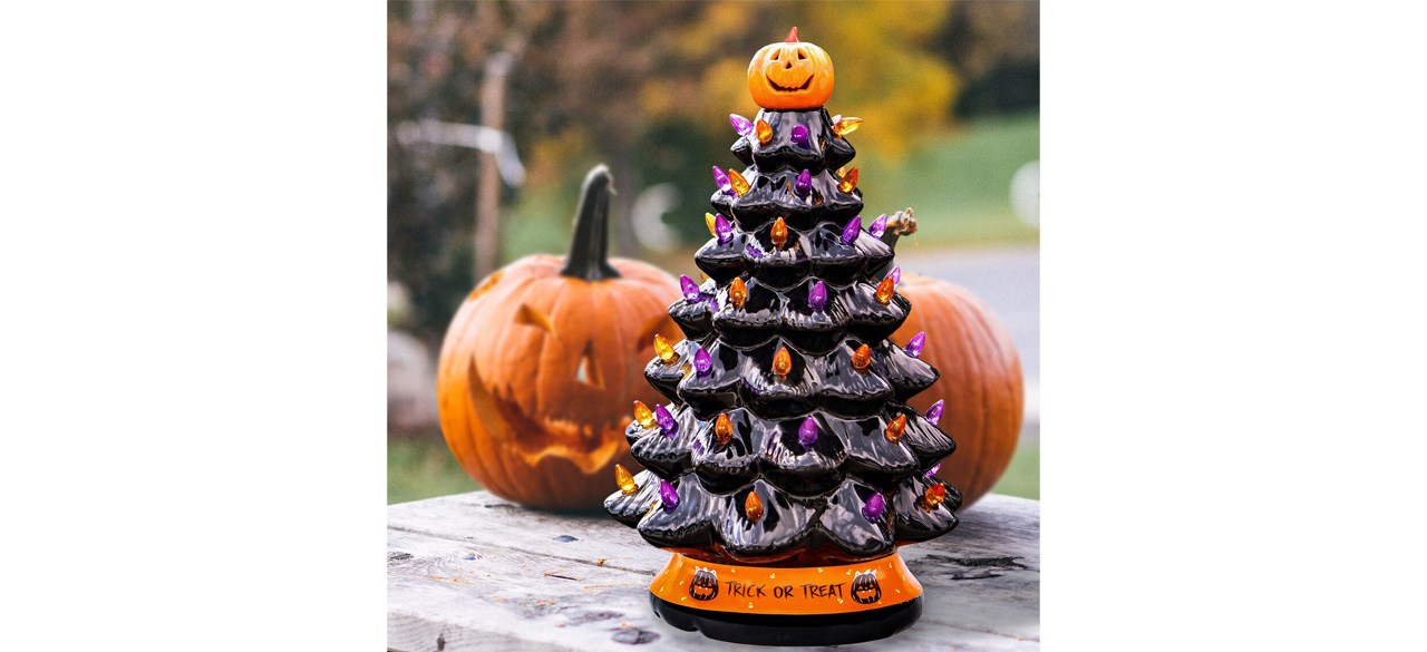  Ceramic Tree Decoration on table with pumpkins in background