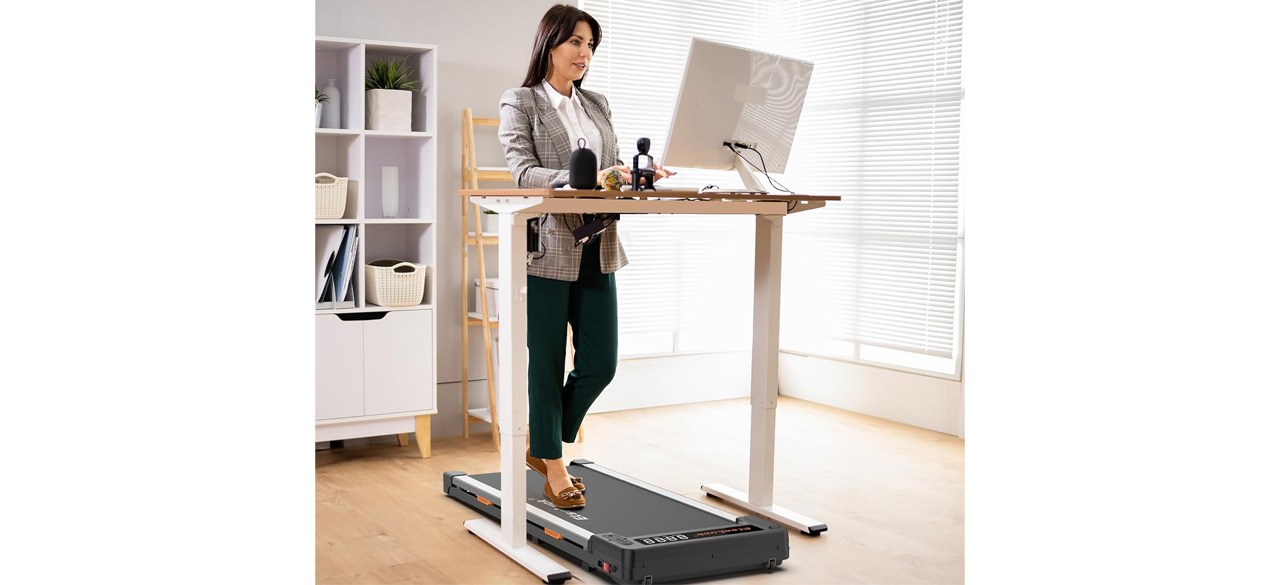 Womn using Elseluck Walking Pad while working at desk