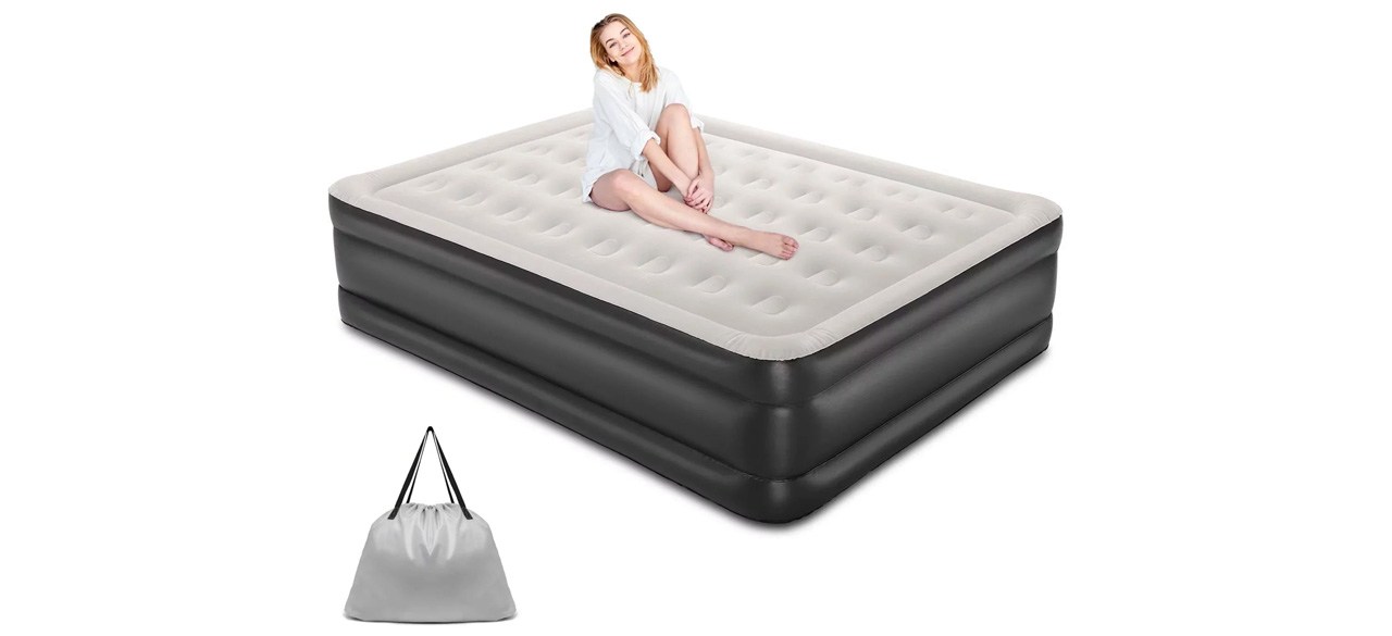 Person sitting on air mattress on white background