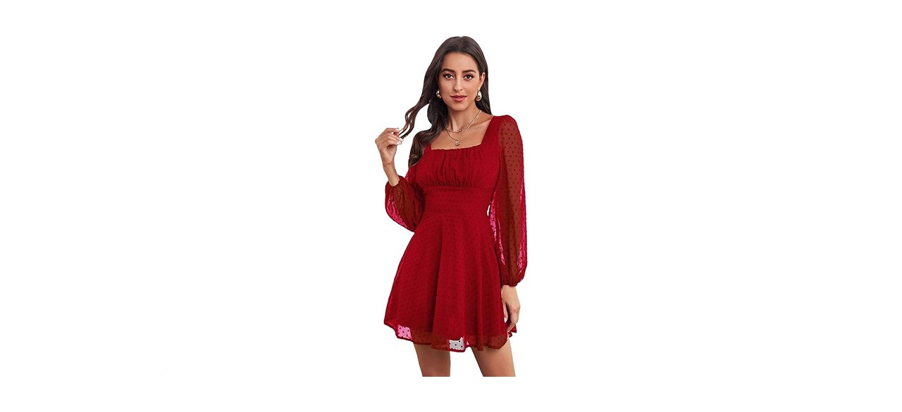 a woman in a long sleeved red chiffon dress 