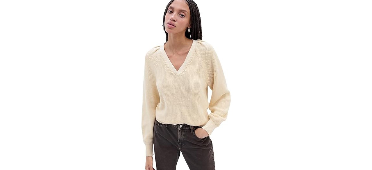 Woman wearing ivory-colored GAP Women's Ribbed V-Neck Sweater