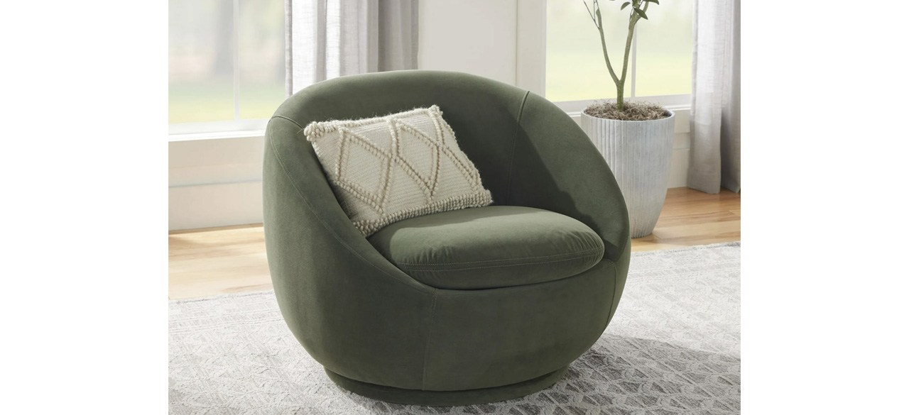 Green Better Homes & Gardens Mira Velvet Swivel Chair with ivory throw pillow