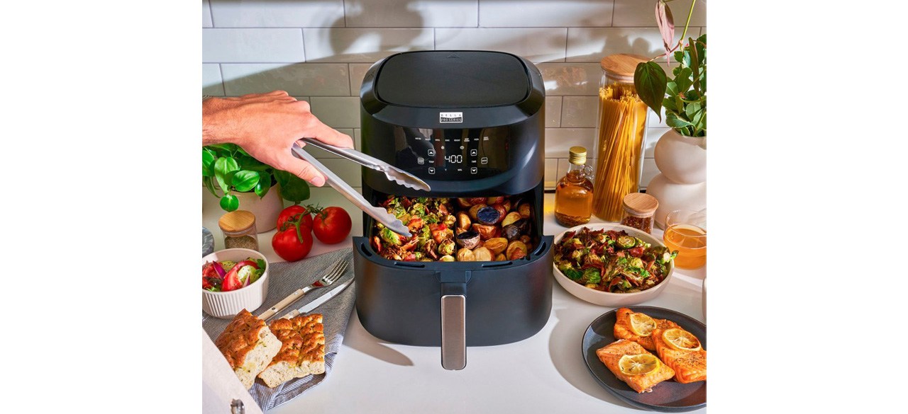 Bella Pro Series 8-Quart Digital Air Fryer on kitchen counter surrounded by food