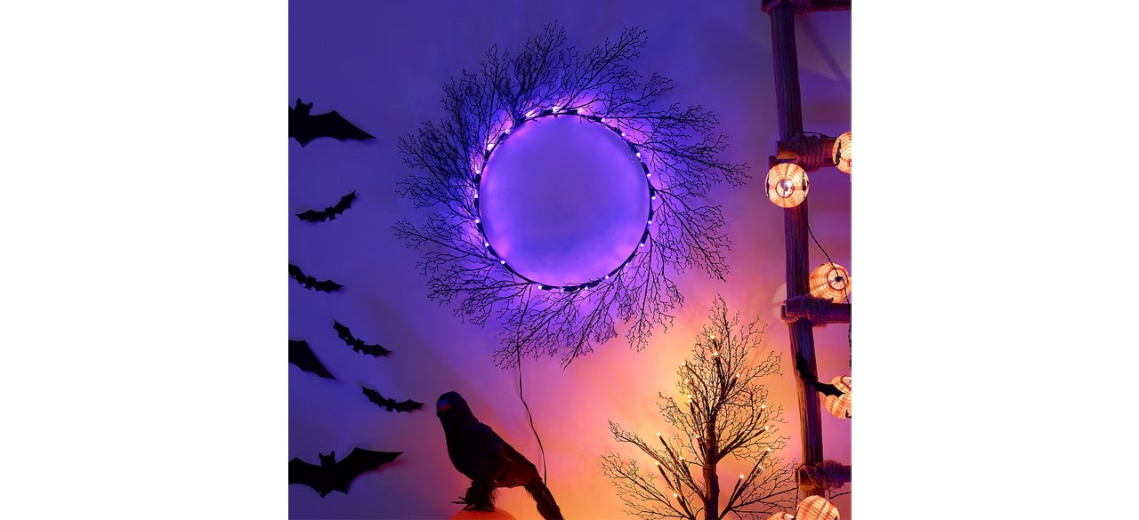 Best Kustfyr LED Wreath hanging on wall with other Halloween decor