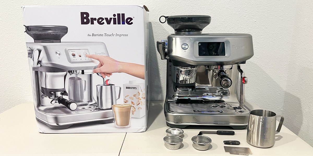 Breville Barista Touch Impress on counter next to product packaging