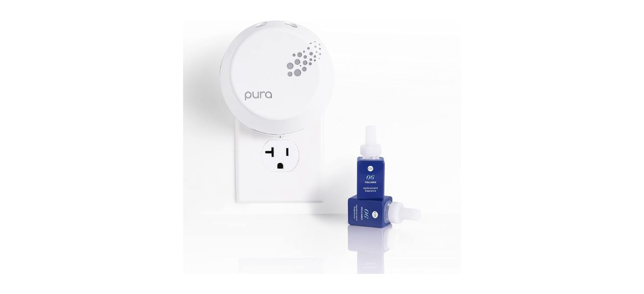 Capri Blue Pura Smart Diffuser Kit plugged into a wall