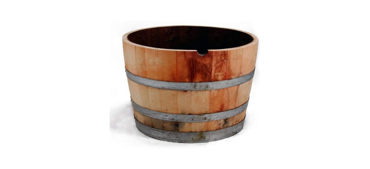 a large planter in the shape of half a wine barrel