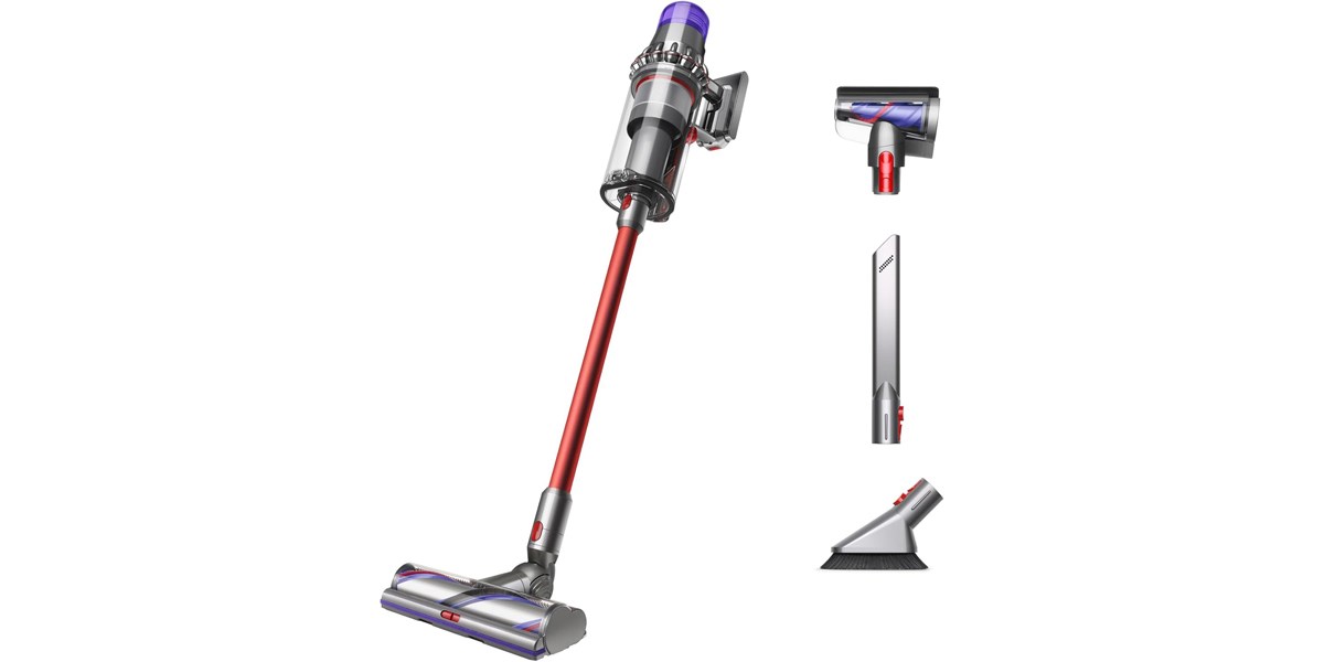 The Dyson Outsize Origin Cordless Vacuum next to its three included accessories