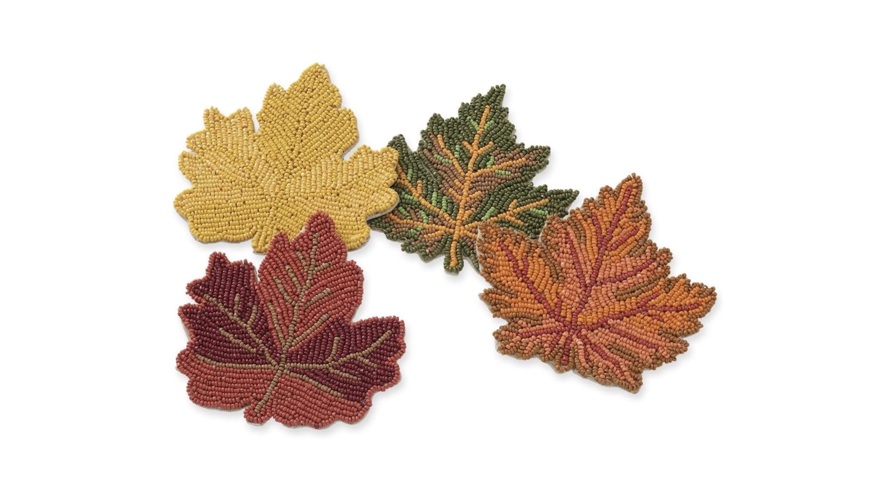 Beaded coasters in the shape of multicolored fall maple leaves