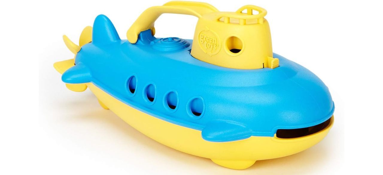 Green Toy Submarine in blue and yellow on white background