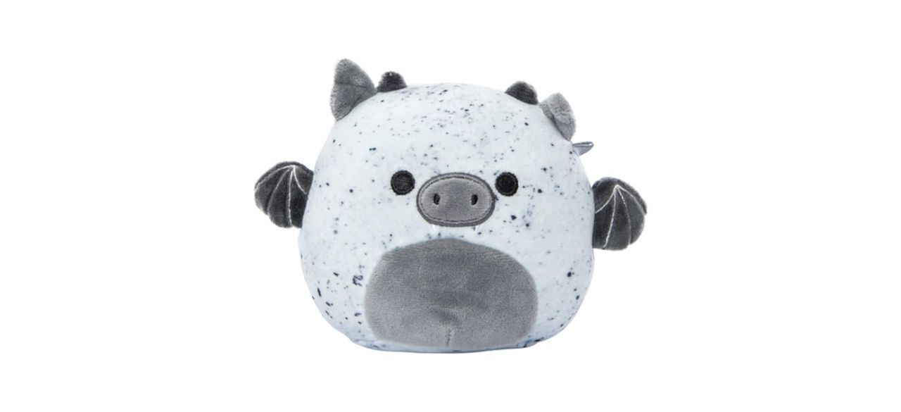 A white and gray spotted gargoyle plushie with a pig nose and ears and bat wings