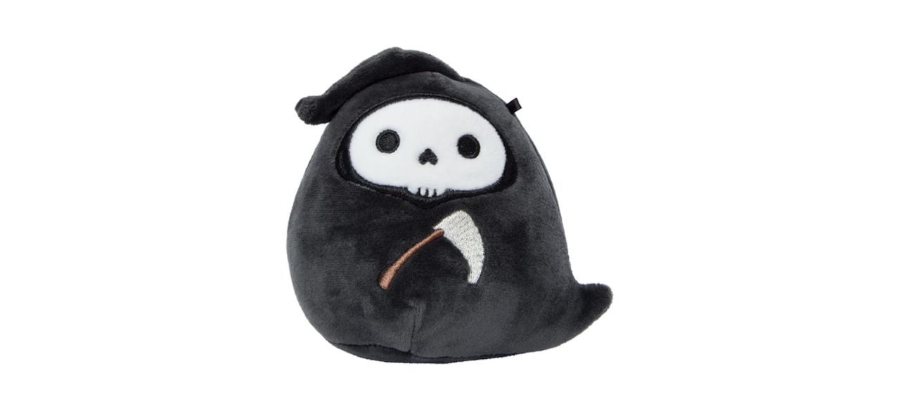 A small black grim reaper plush with a skeleton face. It's holding a scythe.