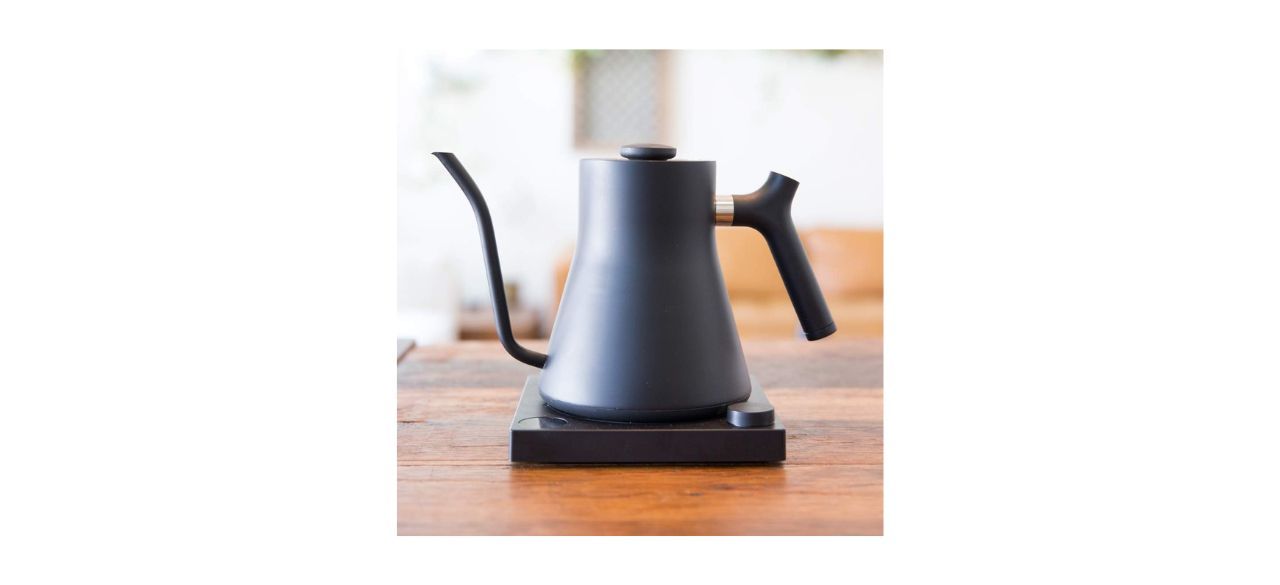 A matte black gooseneck kettle sitting on a counter