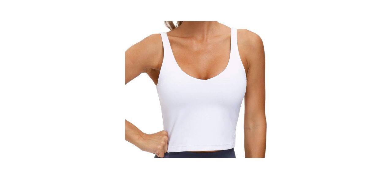 a woman wearing a longline white sports bra