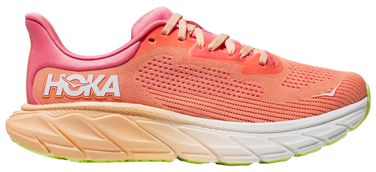 A coral Hoka sneaker with light coral and pink accents.