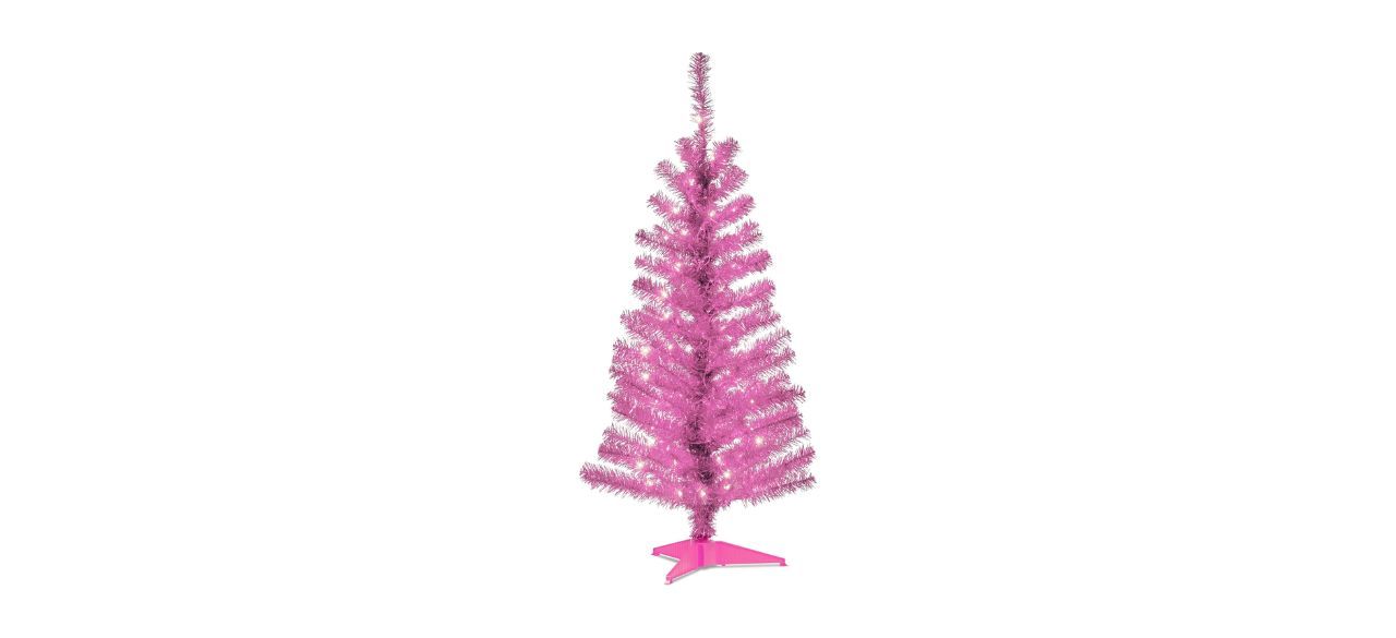 a pink artificial Christmas tree that is prelit and comes with a pink stand