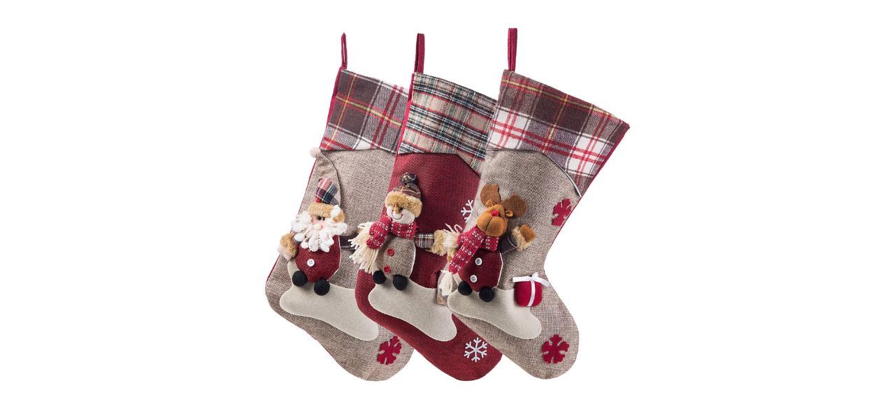 3 red and beige Christmas stockings, one with a design of Santa, one with a reindeer and one with a snowman 