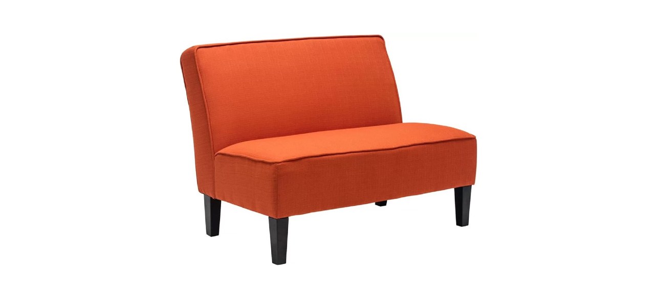 An orange armless loveseat