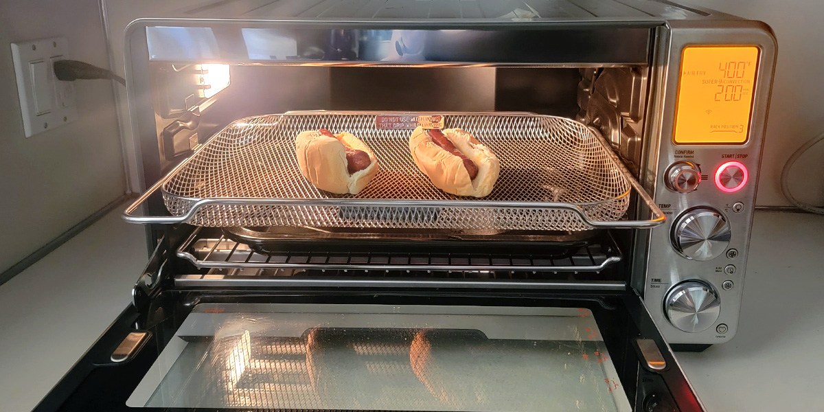 Hot dogs cooking in air fryer oven