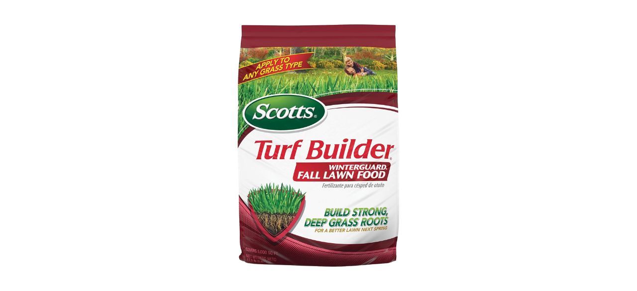 A white and red bag of lawn fertilizer. Packaging indicates you can use it on any grass type.